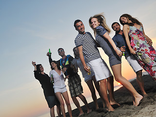 Image showing Group of young people enjoy summer  party at the beach