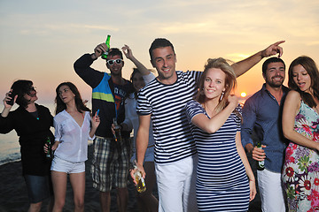 Image showing Group of young people enjoy summer  party at the beach