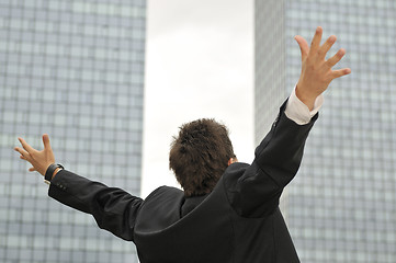 Image showing Outdoor portrait of young and happy  businessman