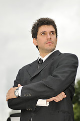 Image showing Outdoor portrait of young and happy  businessman