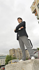 Image showing Outdoor portrait of young and happy  businessman