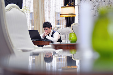 Image showing young adult working on laptop