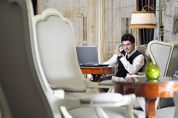 Image showing young adult working on laptop