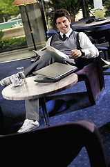 Image showing young adult working on laptop