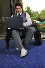 Image showing young adult working on laptop