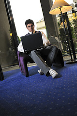 Image showing young adult working on laptop