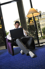 Image showing young adult working on laptop