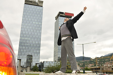 Image showing Photo of happy winner businessman  screaming from joy