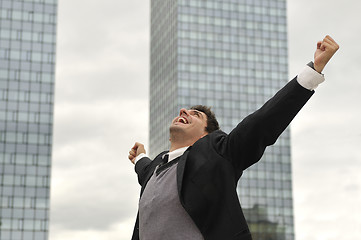 Image showing Photo of happy winner businessman  screaming from joy 