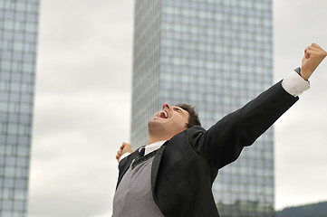 Image showing Photo of happy winner businessman  screaming from joy