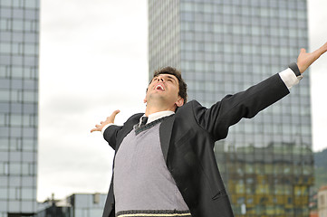 Image showing Outdoor portrait of young and happy  businessman