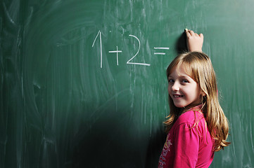 Image showing happy school girl on math classes