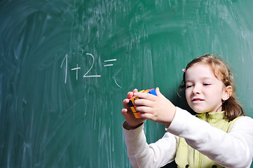 Image showing happy school girl on math classes