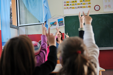 Image showing happy teacher in  school classroom 