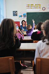 Image showing happy teacher in  school classroom 