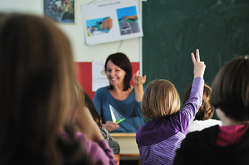 Image showing happy teacher in  school classroom 