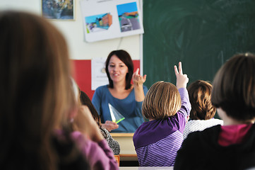 Image showing happy teacher in  school classroom 