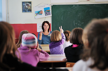 Image showing happy teacher in  school classroom 