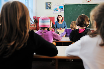 Image showing happy teacher in  school classroom 