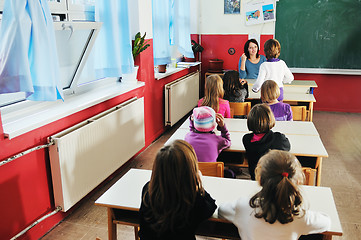 Image showing happy teacher in  school classroom 