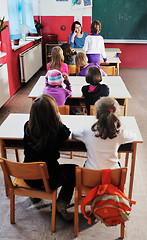 Image showing happy teacher in  school classroom 