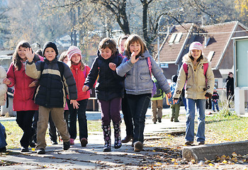 Image showing school girls running away 