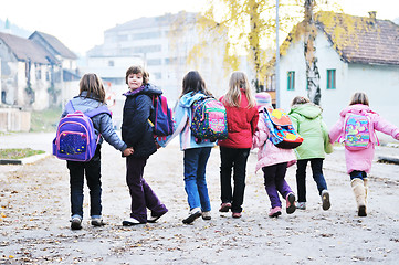 Image showing school girls running away 