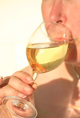 Image showing relaxing  with a glass off wine