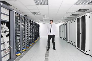 Image showing young engeneer in datacenter server room