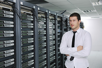 Image showing young engeneer in datacenter server room