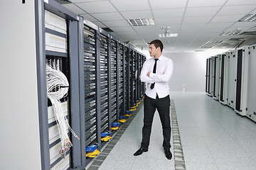 Image showing young engeneer in datacenter server room