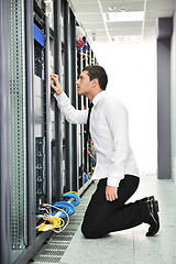 Image showing young engeneer in datacenter server room