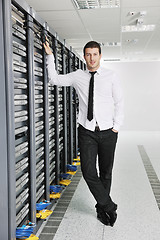 Image showing young engeneer in datacenter server room