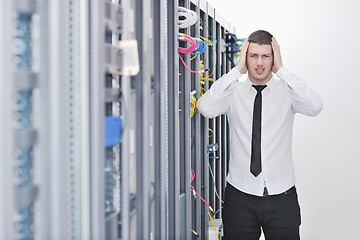 Image showing young engeneer in datacenter server room