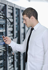 Image showing young engeneer in datacenter server room