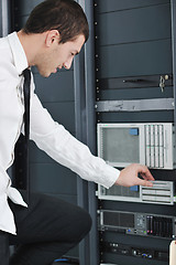 Image showing young engeneer in datacenter server room