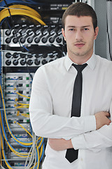 Image showing young engeneer in datacenter server room