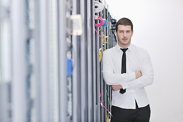 Image showing young engeneer in datacenter server room