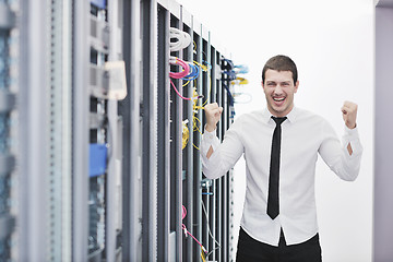 Image showing young engeneer in datacenter server room