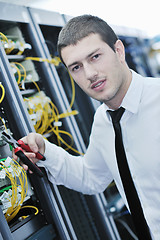 Image showing young engeneer in datacenter server room