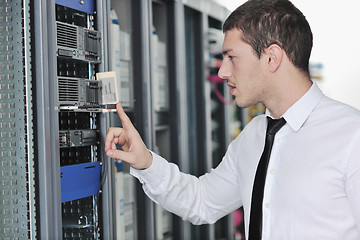 Image showing young engeneer in datacenter server room