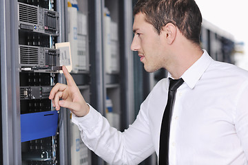 Image showing young engeneer in datacenter server room