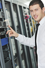 Image showing young engeneer in datacenter server room