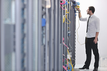 Image showing young engeneer in datacenter server room