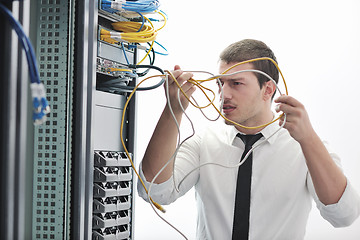 Image showing young engeneer in datacenter server room