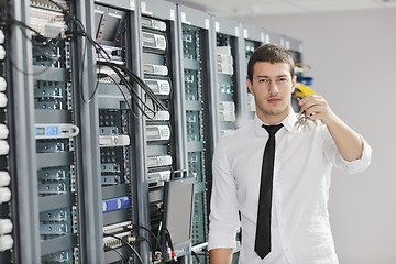 Image showing young engeneer in datacenter server room