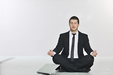 Image showing business man practice yoga at network server room