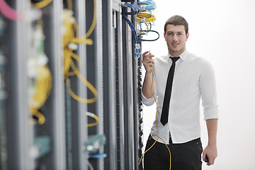 Image showing young engeneer in datacenter server room