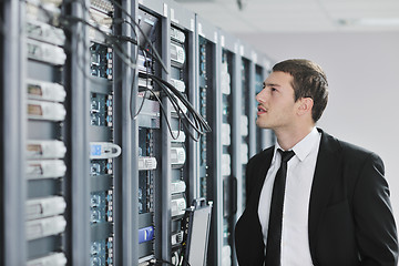 Image showing young engeneer in datacenter server room