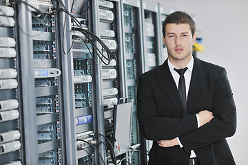 Image showing young engeneer in datacenter server room